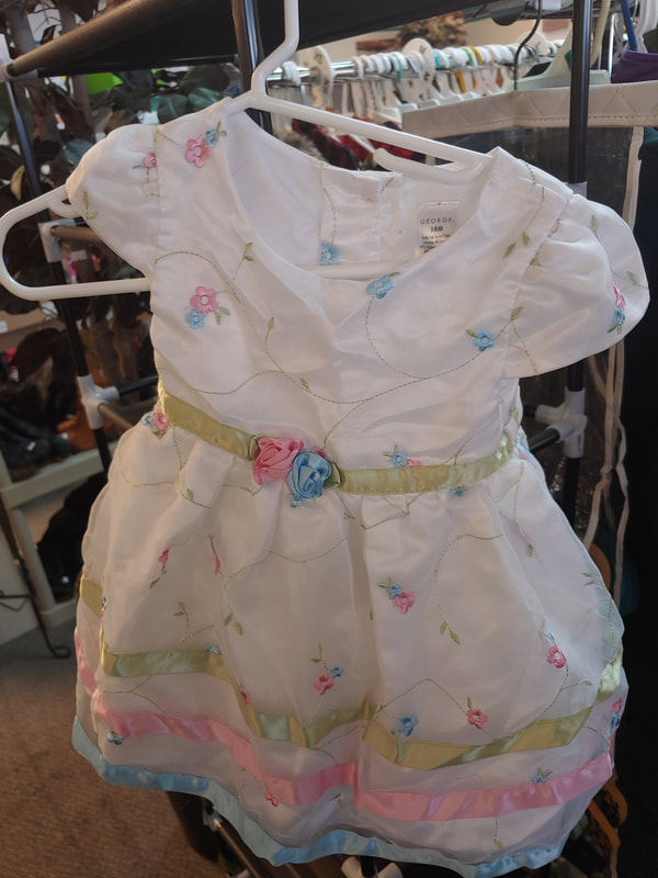 baby dress at a thrift store